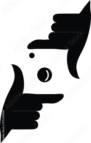 Abstract silhouette of two hands framing a camera lens with a circular aperture symbolizing photography and creative vision against a white background