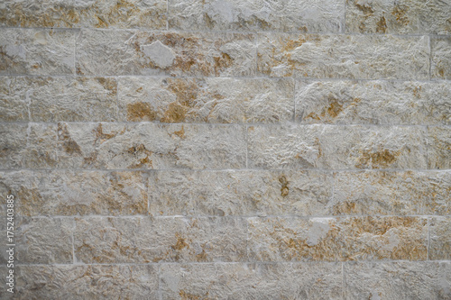 Faux stone wall texture background. Cream wall background.