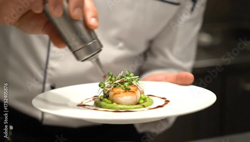 Chef decorating plate with sauce drizzle, fine-dining artistic presentation