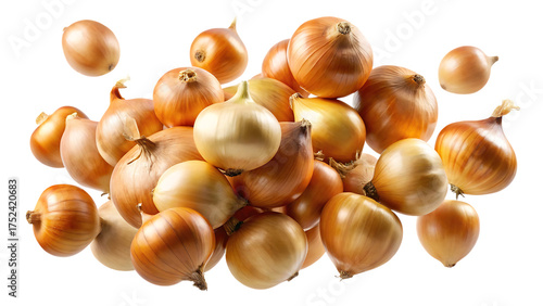 Abundant pile of fresh yellow onions falling isolated on a stark black background for culinary and agricultural concepts isolated on transparent background