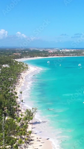 Tropical coastline with resorts, palm trees and caribbean sea. Travel destinations. Dominican Republic. Aerial view