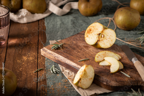 Wallpaper Mural A rustic still life with a sliced Reinette apple on a wooden board, with a glass and whole apples. Torontodigital.ca