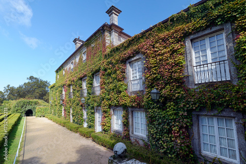 Beautiful manor house covered in greenery at Castrelos Park