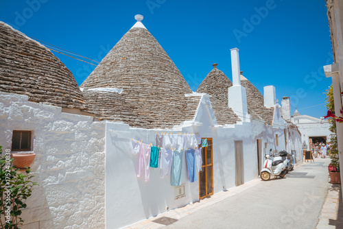 Beautiful old stone trulli houses with conical roofs in Alberobello, Puglia, Italy.