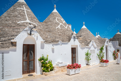 Beautiful old stone trulli houses with conical roofs in Alberobello, Puglia, Italy.