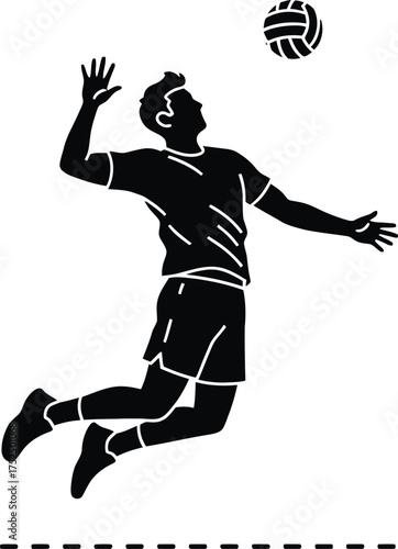 Silhouette of a male volleyball player spiking the ball during a game
