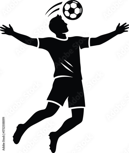 Silhouette of a soccer player heading the ball in mid air