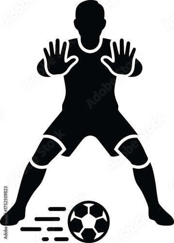 Silhouette of a soccer goalkeeper defending the ball