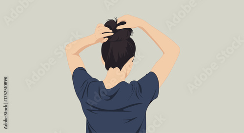 Effortless elegance revealed as she styles her hair into a chic bun, a timeless beauty ritual for a modern woman embracing simplicity and grace