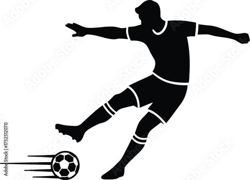 Silhouette of a soccer player kicking a ball in motion