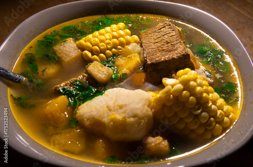 Close up of Venezuelan soup with arepa and lime, traditional Latin American cuisine