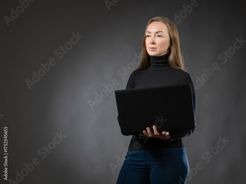 Businesswoman stands with l...