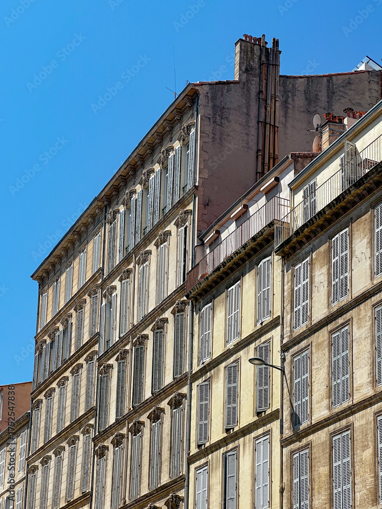 Fototapeta premium Facades of Traditional French Buildings in Marseille on a Sunny July Day