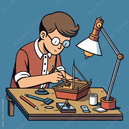 Young person building a miniature ship on a wooden desk