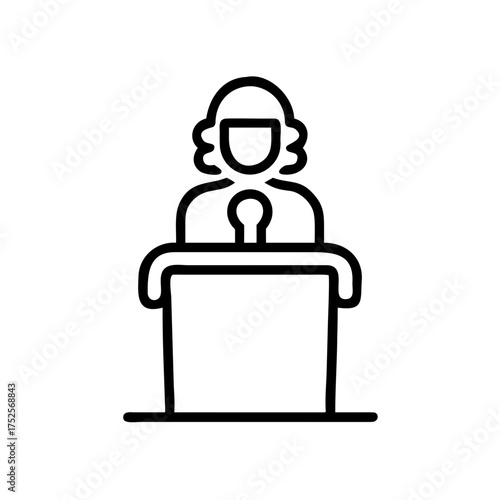 Female speaker at podium delivering speech