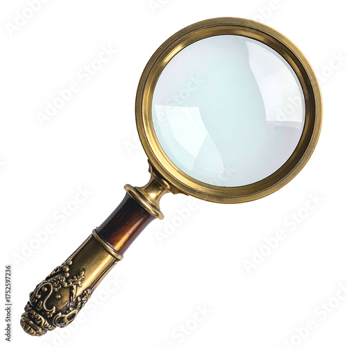 Ornate vintage magnifying glass with brass frame and detailed handle.