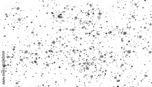 Abstract scattering of grey particles on a bright white background, representing dust or fine particles in motion.