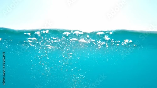 Underwater Bubbles Rising in Clear Blue Water.