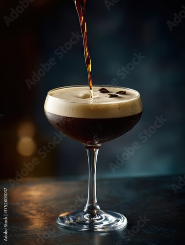 Elegant espresso martini is being poured garnished with coffee beans offering a sophisticated cocktail experience at a stylish bar