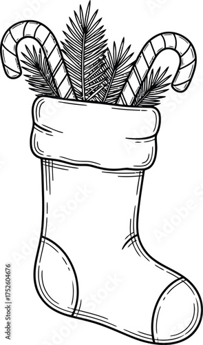 Christmas stocking filled with candy canes and pine branches