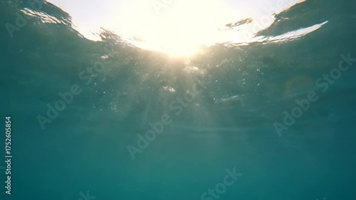 Sunlight Rays Shining Through the Ocean Water Surface.