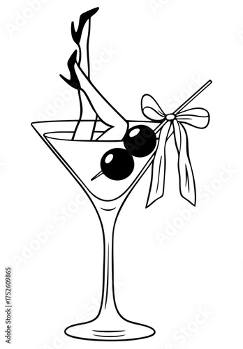 Sexy female legs in high heels peeking from martini cocktail glass with olives