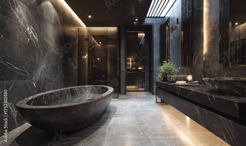 Luxurious bathroom with a dark marble bathtub and modern design.