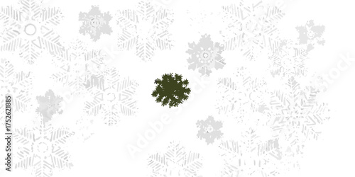 A solitary dark green pine tree stands out against a backdrop of numerous white and gray snowflakes