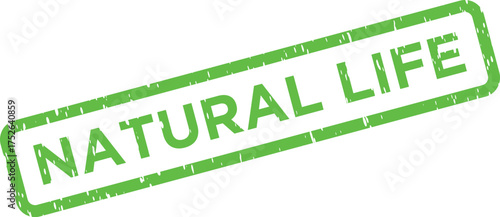 A vivid green distressed rubber stamp clearly showing the words NATURAL LIFE on a crisp white backdrop