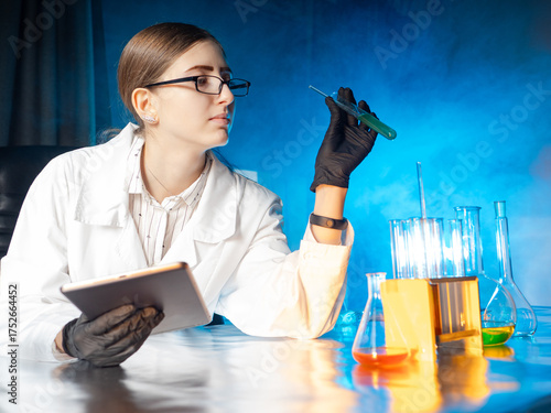 Woman doctor sits in labora...