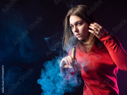 Woman poses with vape devic...