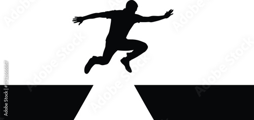 Man Silhouette Jumping Over a Wide Gap or Chasm Representing Challenge and Overcoming Obstacles