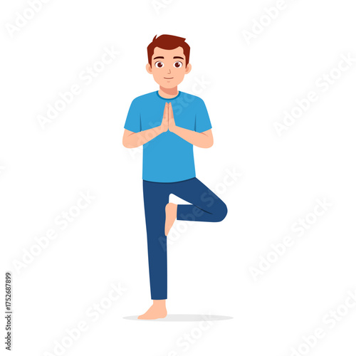 Man Practicing Yoga Balancing on One Leg with Hands in Prayer Position Standing Still