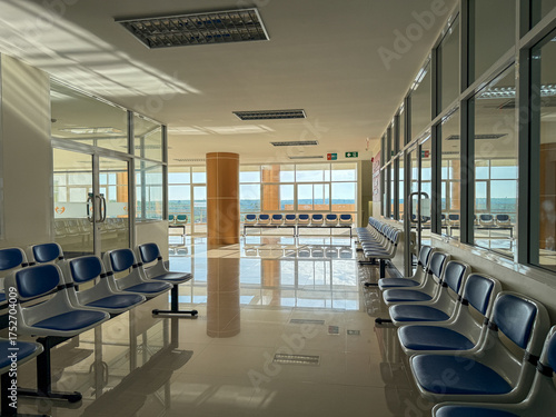 The atmosphere inside a hospital building in Thailand and there are waiting chairs.