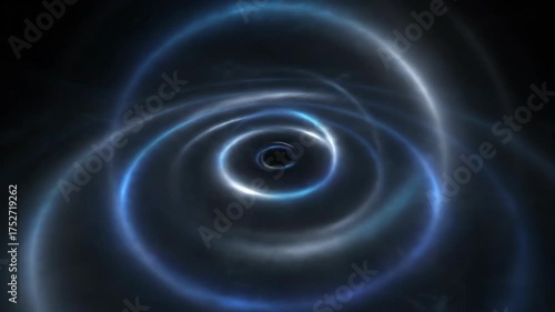 A glowing, circular light pattern resembling a black hole or vortex in a dark surrounding space.