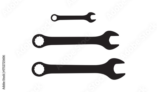 Three black wrenches of varying sizes on a white background