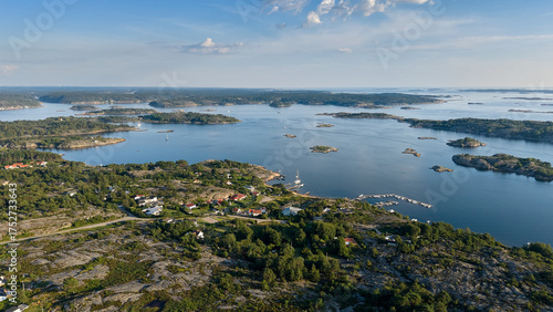 Aerial View of Coastal Archipelago Landscape in Strömstad, Sweden with Rocky Islands, Forests, and Calm Blue Water on a Clear Summer Day