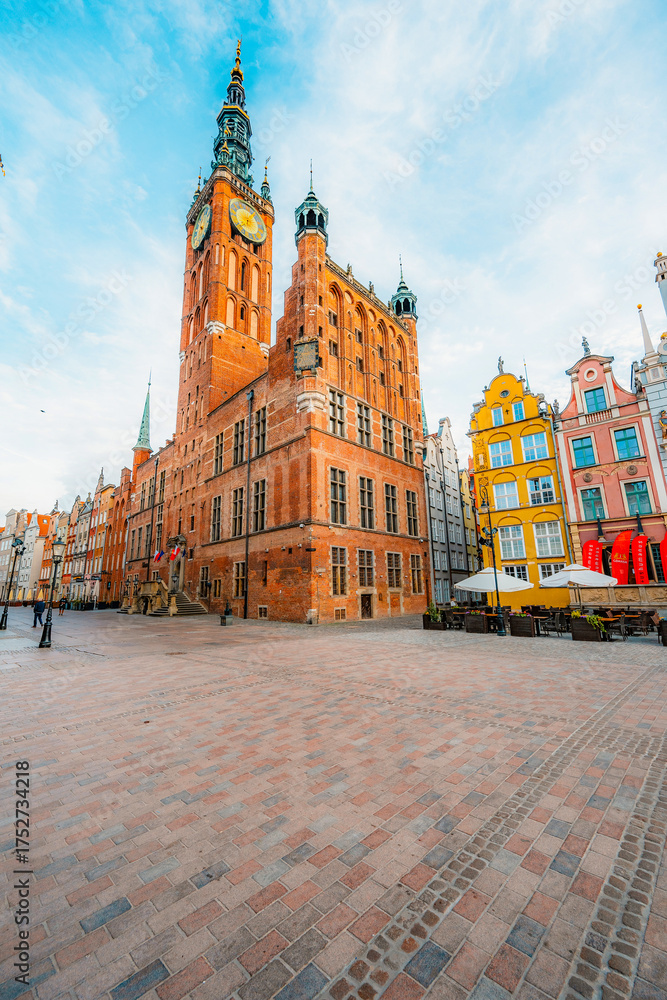 Naklejka premium Gdansk with Motlawa river in Poland. Old town colourful house with saint Marys church i main square.