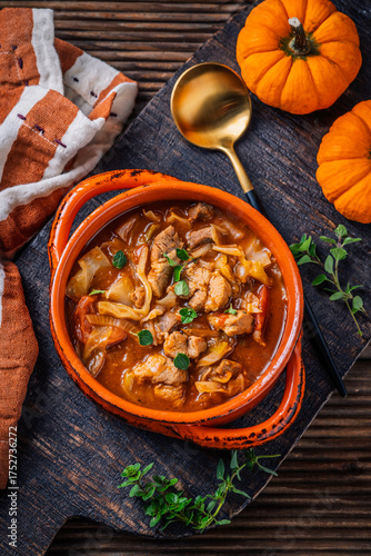 Warm stew with meat, cabbage and pumpkin, comfort autumn dinner balanced food