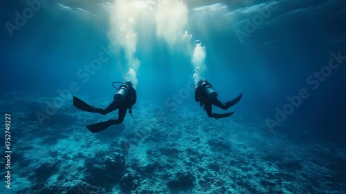 Underwater Adventure: Exploring the Depths with Scuba Divers and Sunlight Rays Dancing