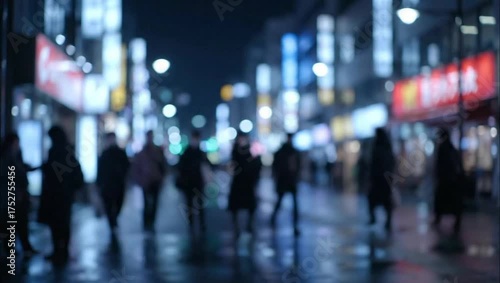 Wallpaper Mural Blurred street scene at night with pedestrians and bright lights illuminating the buildings around them Torontodigital.ca
