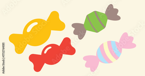 Four colorful wrapped candies on a light cream background candy sweet