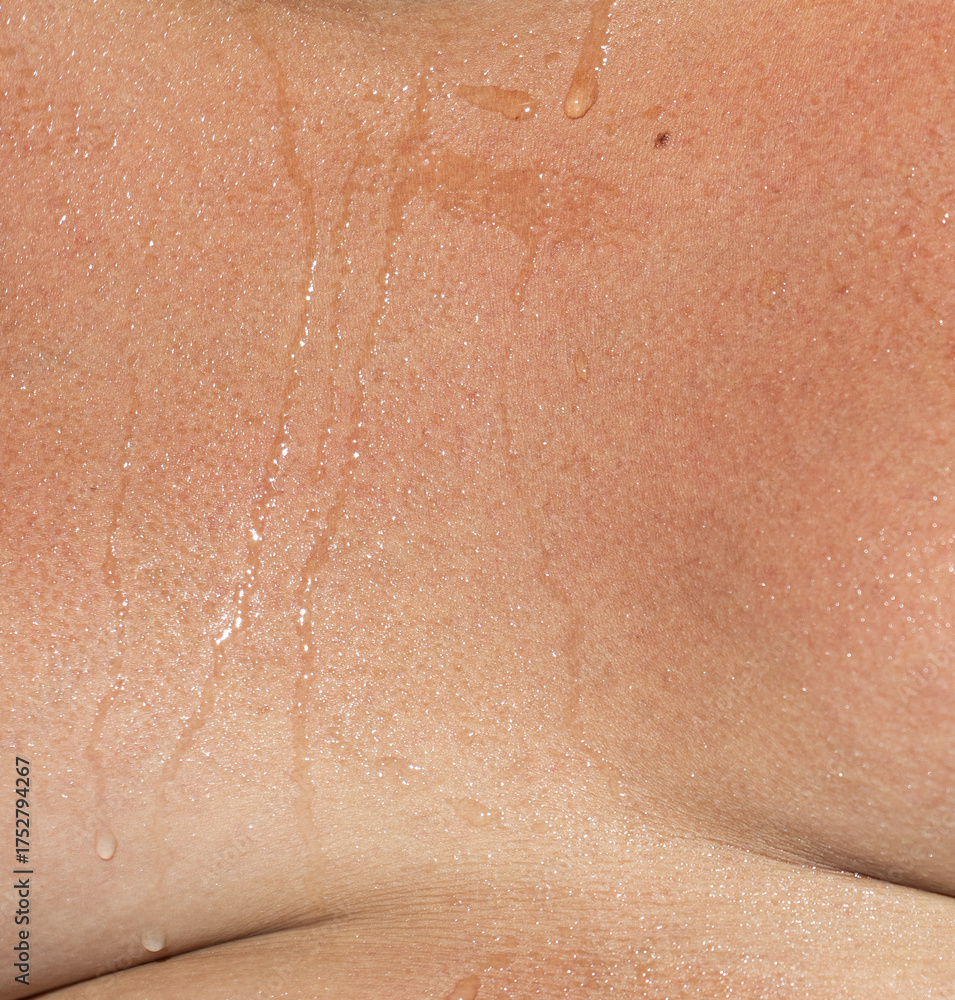 Fototapeta premium A woman's chest is wet with sweat