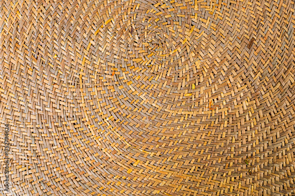 Fototapeta premium Spiral Woven Straw Basket Texture Background