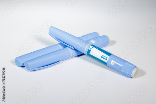 Semaglutide GLP-1 pens with bottle of pills and measuring tape for medical concept