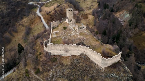 The ruins of the Castle of Graines Val D'Ayas, Aosta valley, aerial view, winter season
