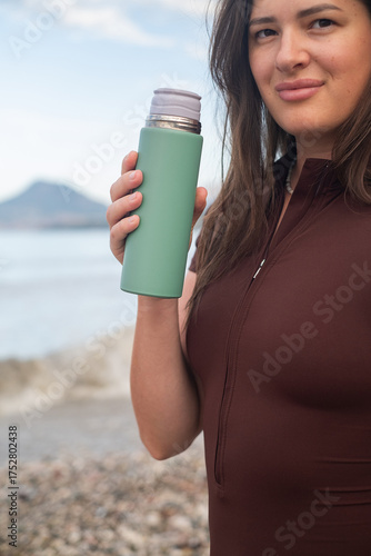 Active outdoor fitness on the coast staying hydrated recovery and wellness healthy lifestyle by the sea