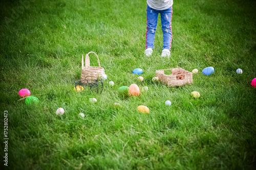 Colorful Easter Eggs and Baskets on Green Grass During Egg Hunt