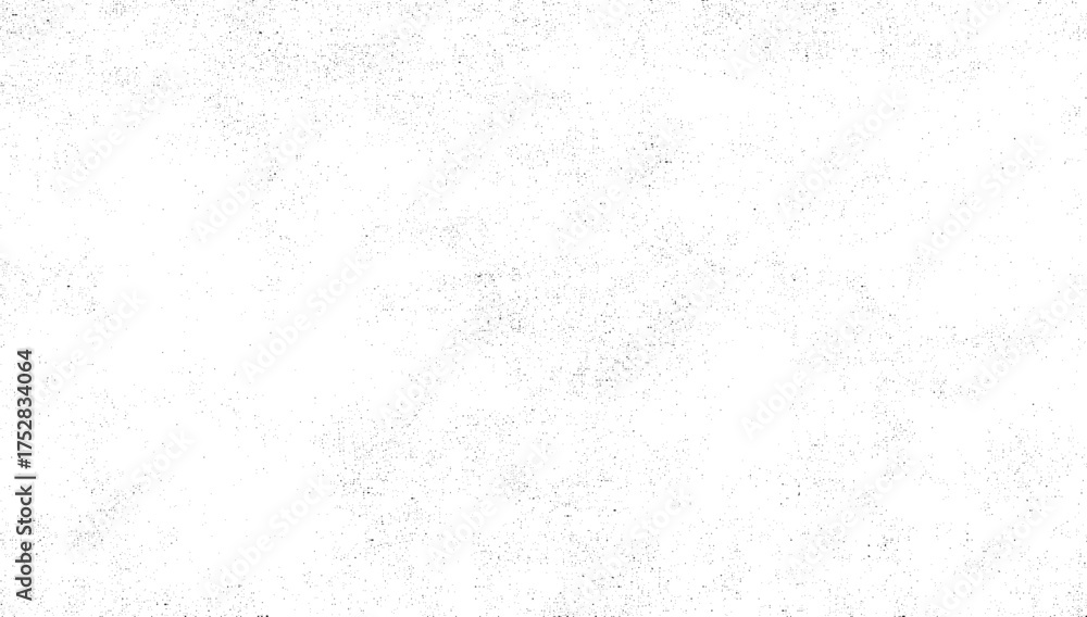 Obraz premium A white surface with a sparse, random distribution of small black dots creating a textured effect.