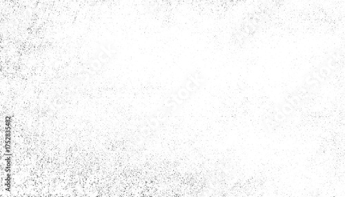 White background with a distribution of dark speckles and irregular shapes.